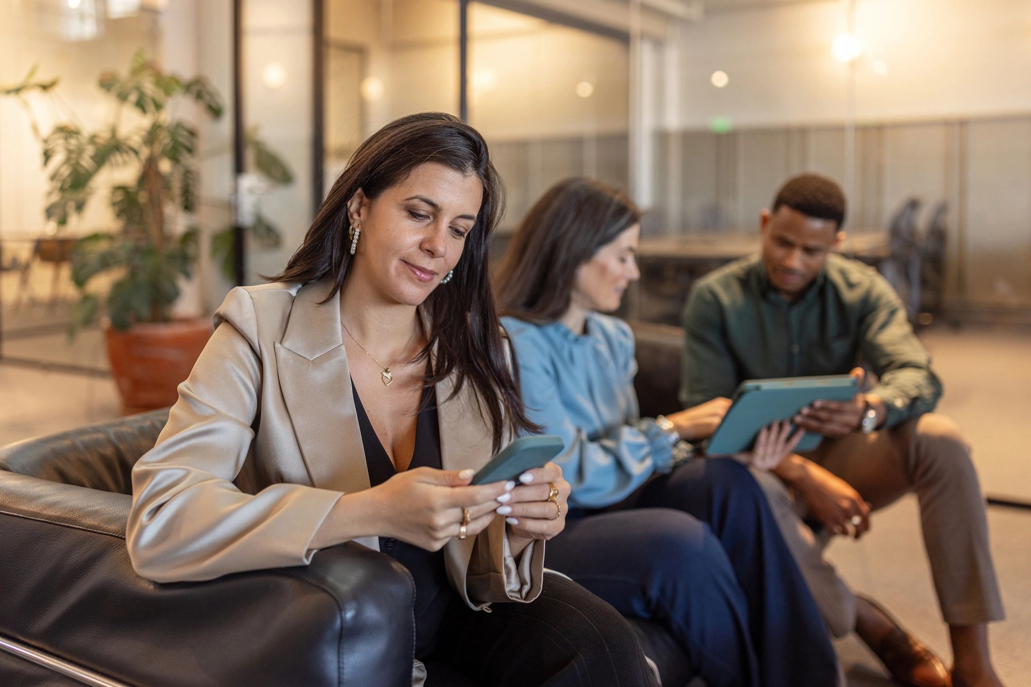 Business colleagues collaborating with a smartphone and tablet while planning content